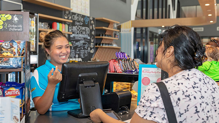 cafe staff taking woman's order