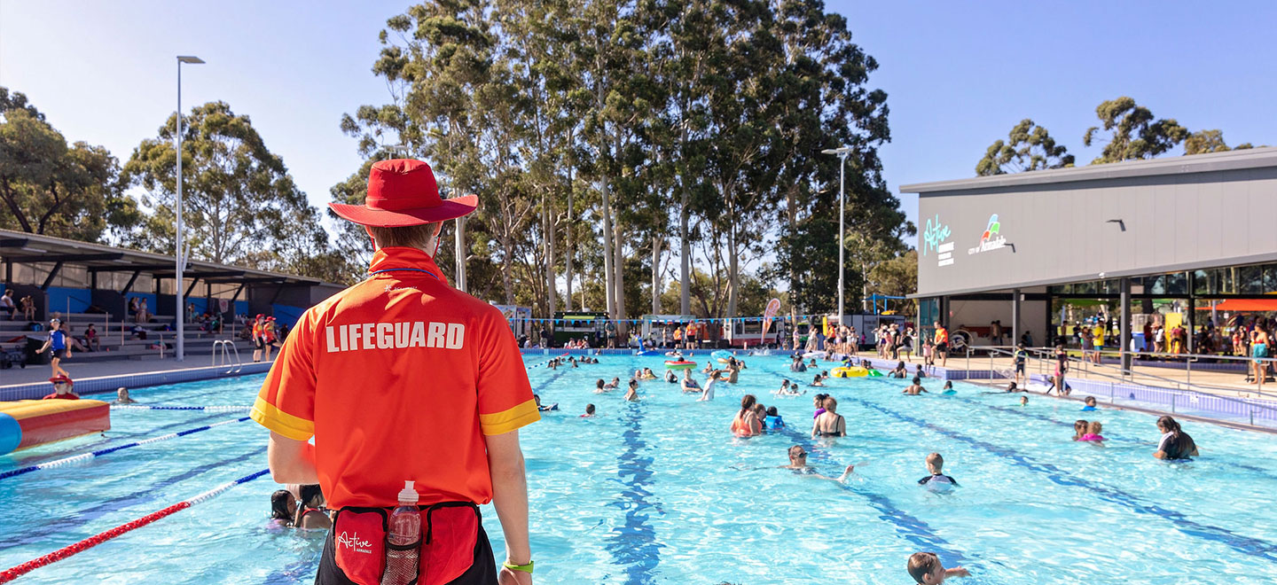 lifeguard supervising outdoor pool